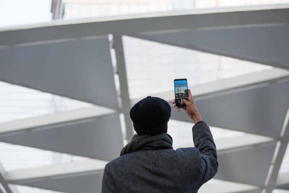 A man taking a picture with his smartphone