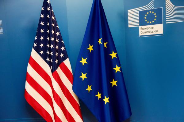 Flag of the United States, on the left, and the flag of the EU